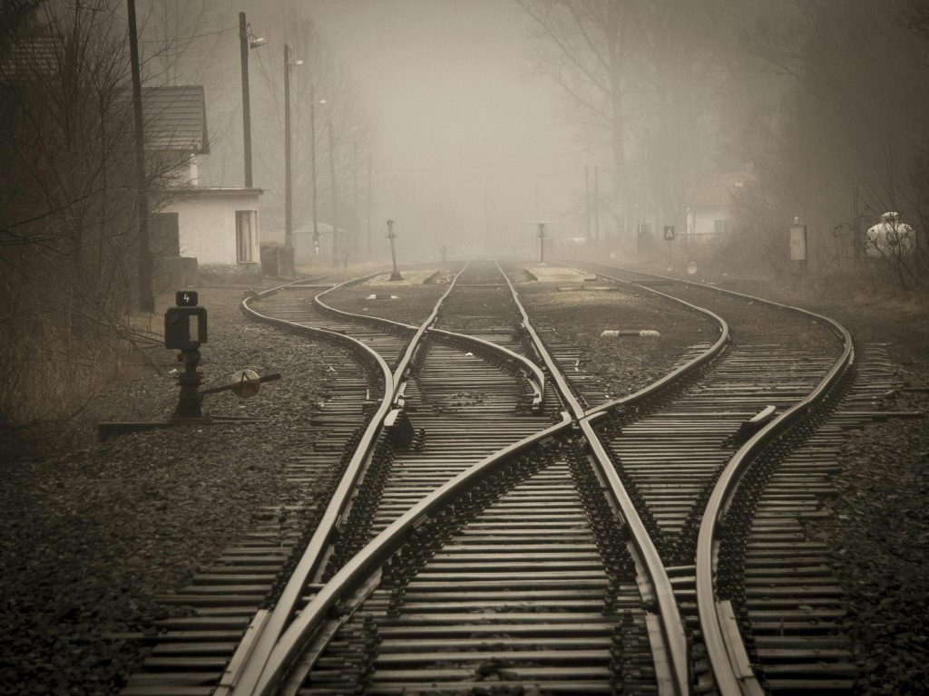 pexels-photo-258510-258510 Moody foggy railway tracks in a misty landscape, evoking travel and mystery.