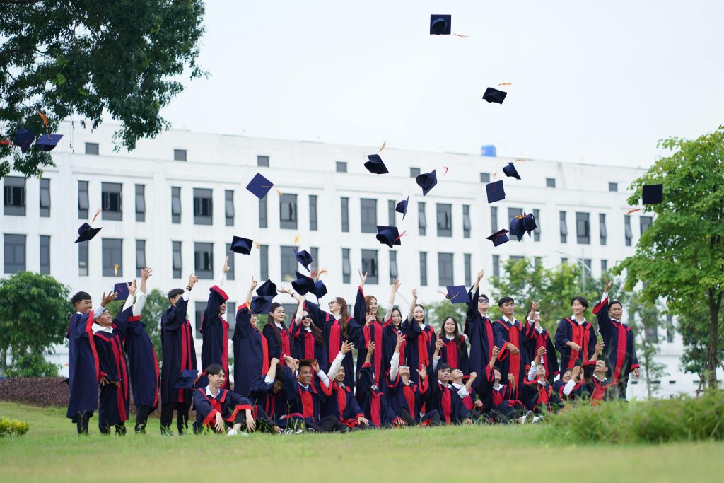 pexels-photo-30562665-30562665 A group of graduates in Vietnam celebrate by throwing caps into the air.